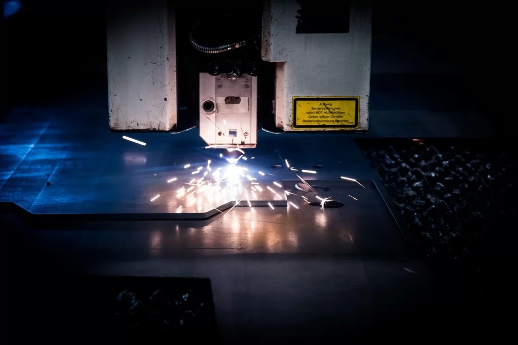 a laser cutting cnc machine laser cutting a steel plate