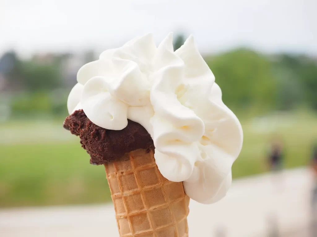 vanilla ice cream with chocolate in a cone