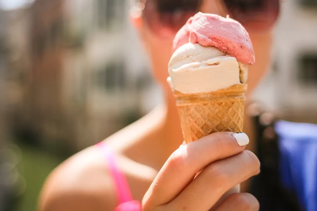 strawberry and vanilla ice cream in a cone