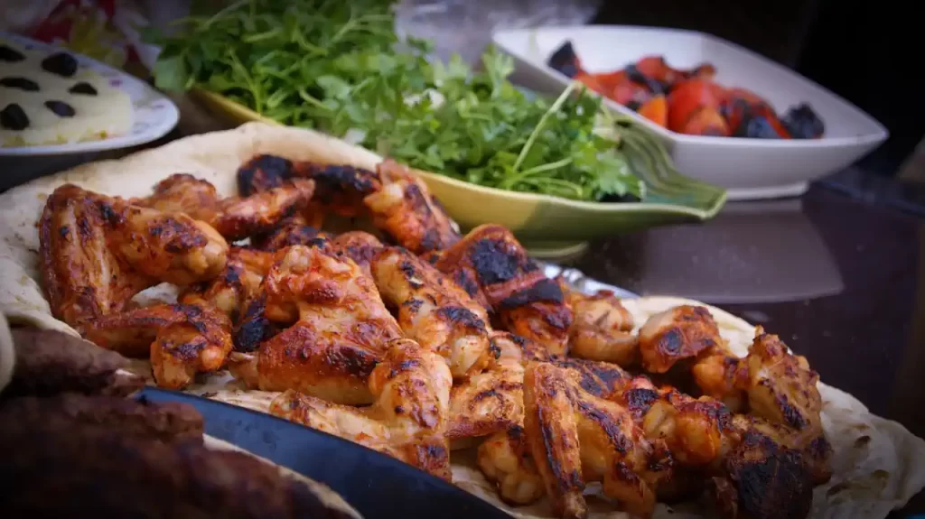 grilled chicken on a bbq plate