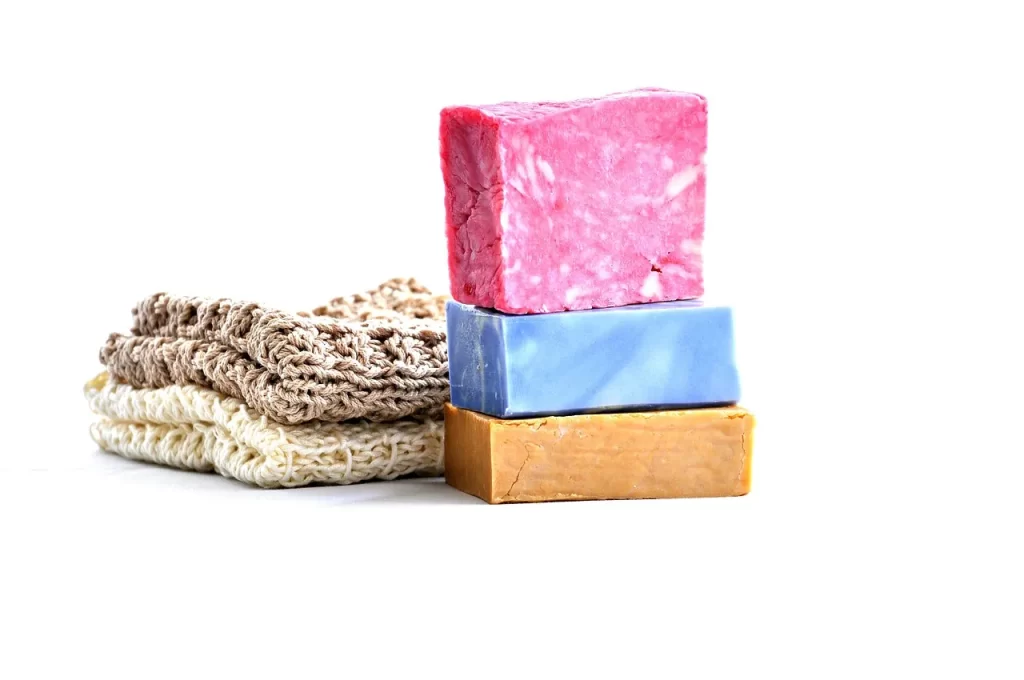 pink, blue and yellow soap with white background