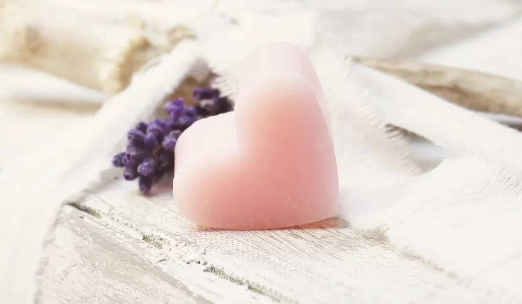 a heartshaped soap on a wooden table