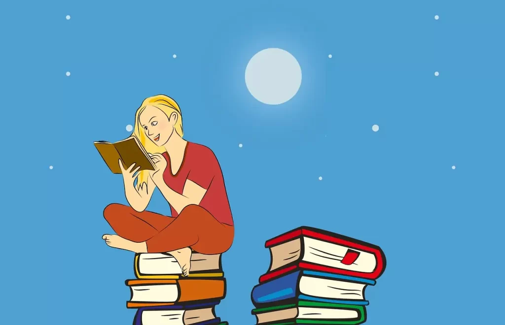 girl sitting on books reading outside in the moonshine